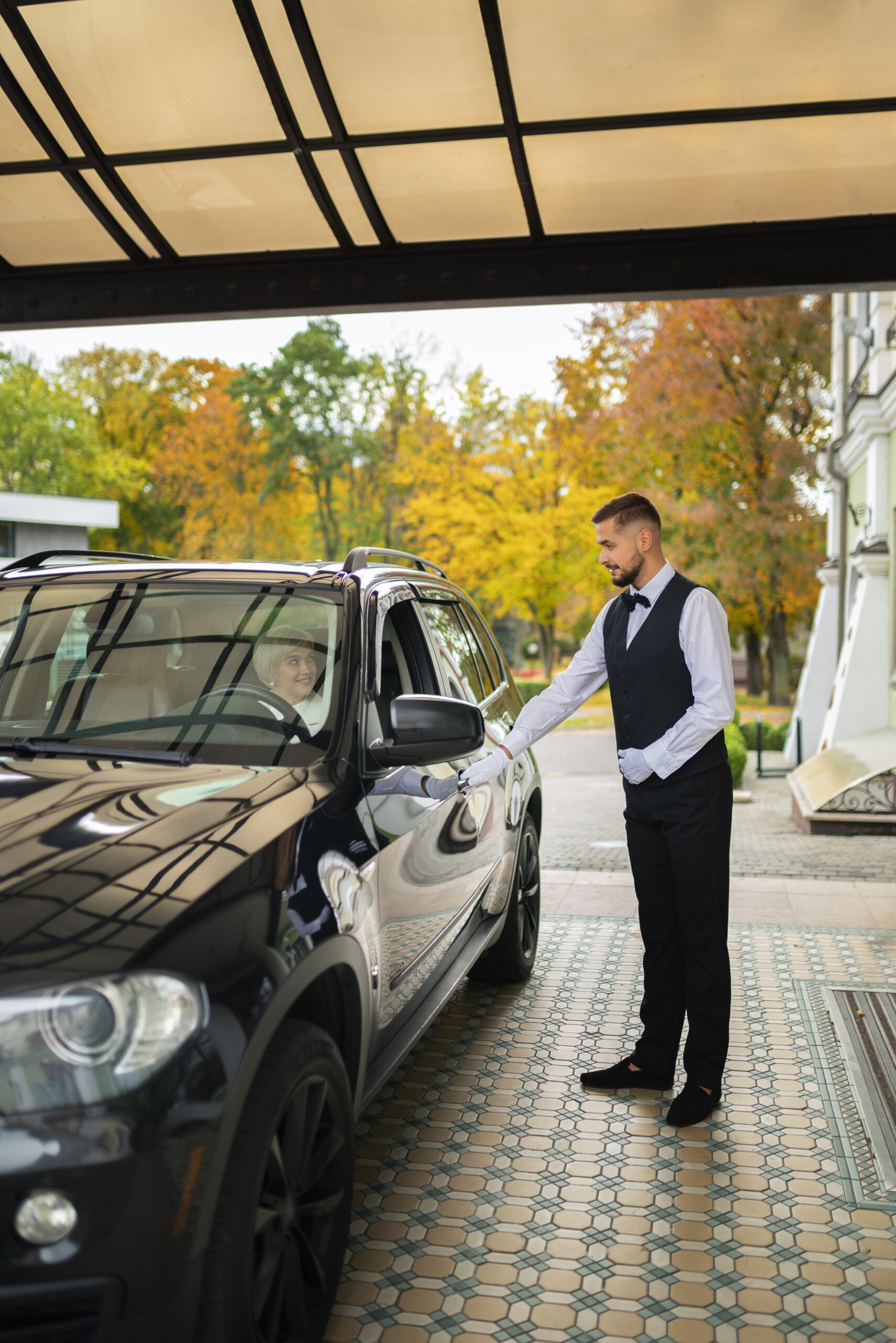 parking valet taking care customer vehicle scaled